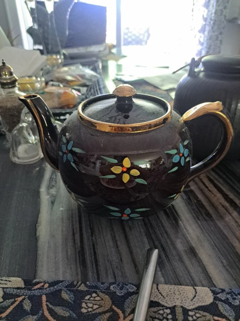 This is a vintage Sadler England teapot in a dark brown glaze, often referred to